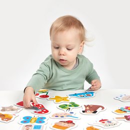  Colorful puzzle pieces featuring various animal shapes and designs. Suitable for children aged 15 months and up. Encourages hand-eye coordination and early learning.