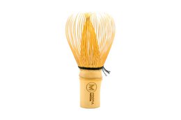 Bamboo matcha whisk with natural bristles for preparing traditional Japanese matcha tea.