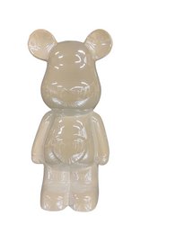 A white ceramic bear figurine measuring 28cm in height.