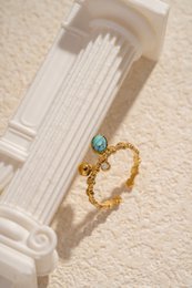 Verstelbare gouden stalen ring met ovale steen en strass