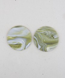 Emerald swirl drop earrings with a round, marbled design in shades of green.