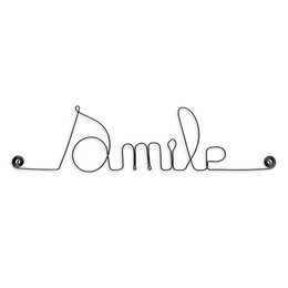 A wire word art piece in the shape of the word "Smile", suitable for decorating a child's room or nursery.