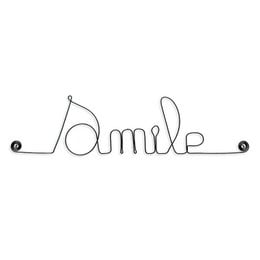 A wire word art piece in the shape of the word "Smile", suitable for decorating a child's room or nursery.