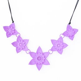 Lavender floral necklace with 5 star-shaped charms