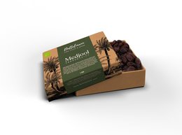 Organic Medjool dates, 1kg. Dried fruit in a brown box with palm tree graphics. Medjool dates are a large, soft, and sweet variety of dates.