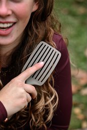 "Hairbrush 'BRUSH & GO' - Value Pack 50+10 FREE. Black plastic hairbrushes with a grid-like pattern on the bristle surface."
The product images show a set of black plastic hairbrushes with a grid-like pattern on the bristle surface. The brushes appear to be part of a value pack, with 50 brushes plus an additional 10 free. The product is categorized as a Hair Brushes item.