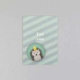 Colorful leopard-patterned magnet with postcard, featuring a pink heart shape.