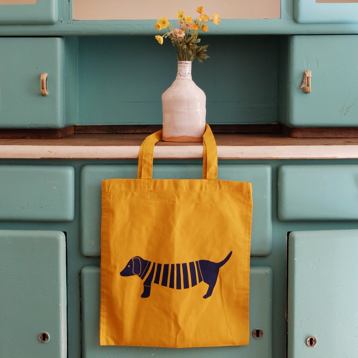 hand-printed fabric bag with mustard dachshund motif
