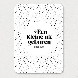 A black and white greeting card with the text "Kleine UK" (Little UK) and a polka dot pattern in the background.