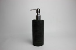 Round soap dispenser in crocodile look-black and stainless steel