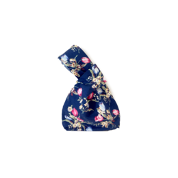 Navy blue handbag with floral tulip pattern, made of fabric material.