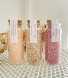 Lavender, chamomile, and vanilla bath salts in glass jars. Relaxing bath soak with natural ingredients.