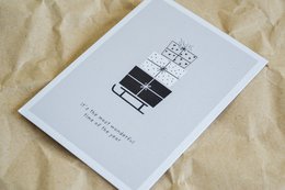 Christmas card with text "It's the most wonderful time of the year" and a simple geometric design.