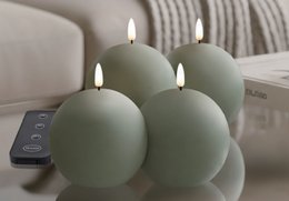 Green LED ball candles with remote control, flameless lighting, modern home decor set.
