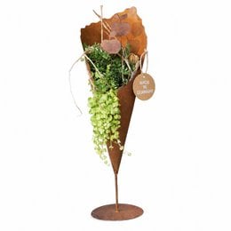 Tall, rust-colored metal planter vase with a stick-on base plate, suitable for displaying blooming plants or greenery. Dimensions: 69 cm or 83 cm in height.