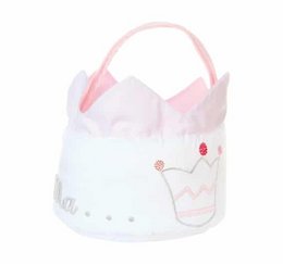 A white and pink plush diaper bag in the shape of a princess crown. The bag has a soft, fluffy texture and a handle for easy carrying.