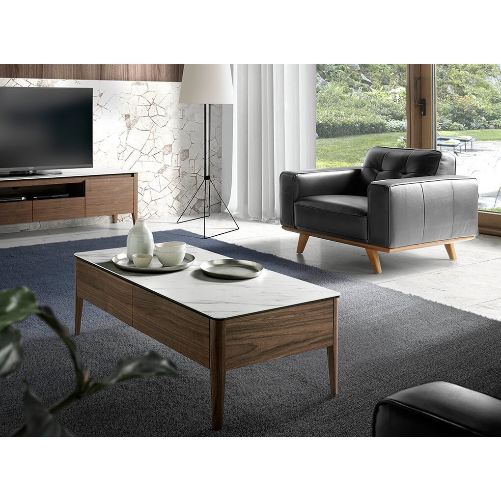Armchair upholstered in leather and Walnut wood legs