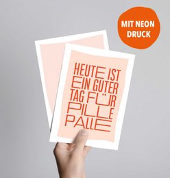  Postcard with text "Heute ist ein guter tag fur pille palle" in bold orange letters on a light background. The text translates to "Today is a good day for Pillepalle".