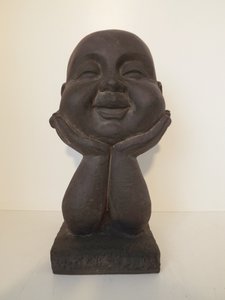 Garden monk head on hands
