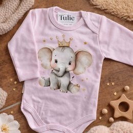 Pink baby bodysuit with cute elephant wearing crown graphic design, long sleeves, newborn clothing.