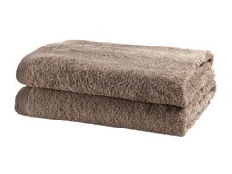 Plush, absorbent walnut-colored bath towels made of high-quality terry cloth material.