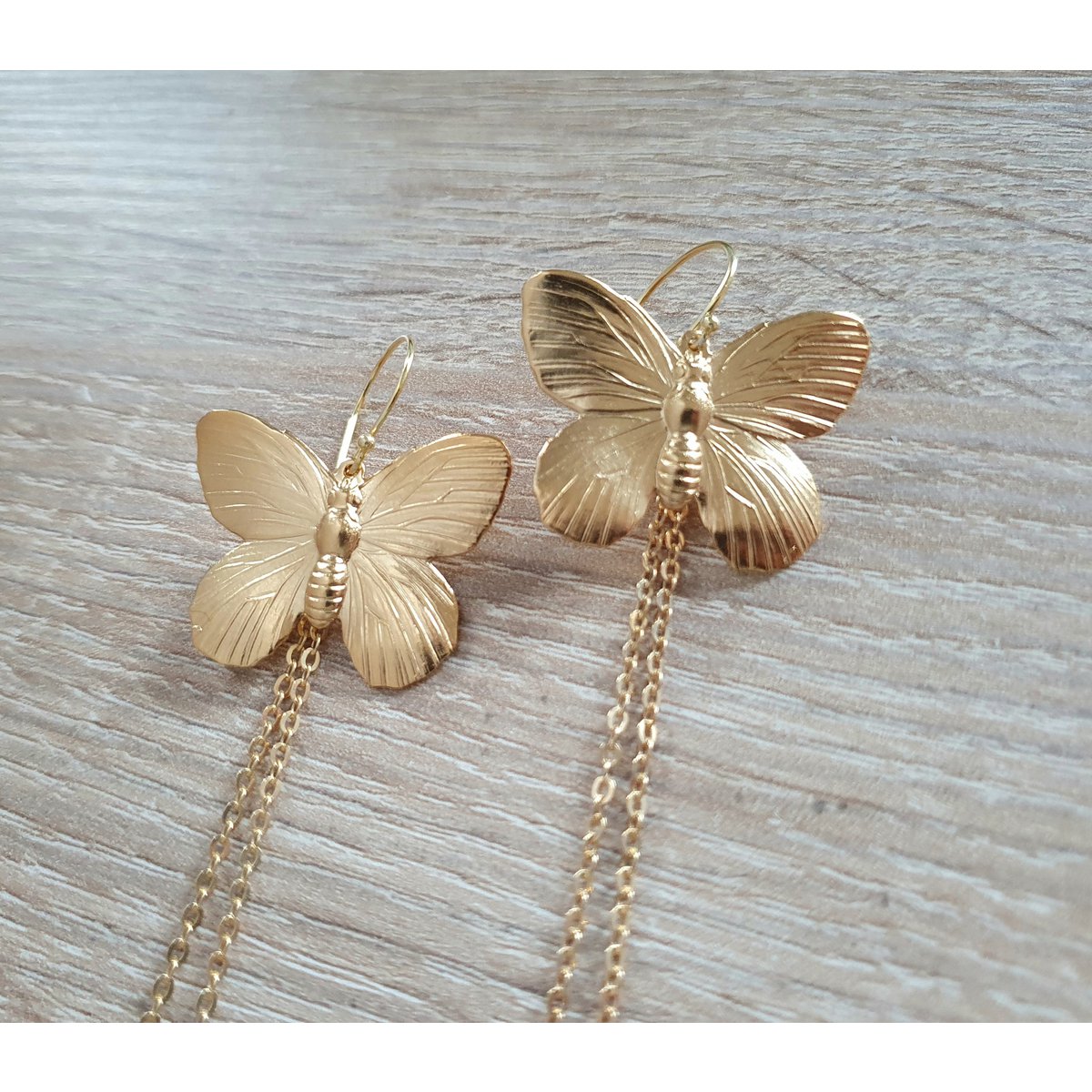 Long-length rhodium plated butterfly earrings