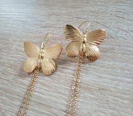 Long-length rhodium plated butterfly earrings