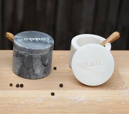 Marble salt and pepper jars with wooden lids, suitable for dinner sets.