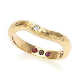 A hammered gold ring with a diamond and ruby accents, perfect for making a statement.
The Pre-Set Hidden Inner Strength Ring in Gold Hammered features a textured, hammered gold band with a single diamond accent and three ruby accents. The ring has a bold, statement-making design that would pair well with casual or formal attire. The hammered finish gives the ring a unique, artisanal look. This ring would be a great choice for someone looking to add a touch of glamour and personality to their jewelry collection.