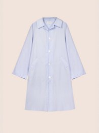  A long, light blue striped trench coat with a belted waist and oversized sleeves. The coat has a classic trench style with a collar and button closure.
