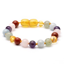 Colorful Baltic amber and gemstone bracelet for kids, featuring round amber beads in shades of yellow and orange, along with multicolored gemstone beads in various shapes and sizes.