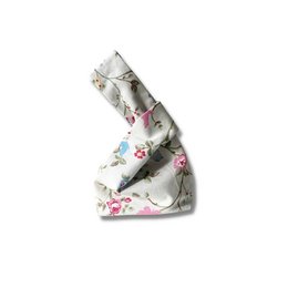 Floral patterned Japanese knot bag with a structured shape and a drawstring closure.