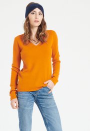 Pumpkin orange cashmere V-neck sweater for women, available in sizes S-2XL. Features a classic V-neck design and soft, warm cashmere material.