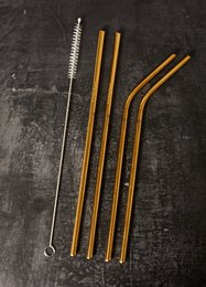 Set mit 4 goldenen Strohhalmen