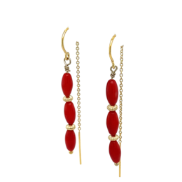 Red oval-shaped earrings with gold-tone accents, featuring a dangling, cascading design.