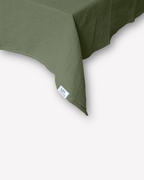 Olive green muslin tablecloth, soft natural fabric, square rectangular shape, minimalist design