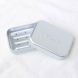 Rectangular silver soap dish with drip grid, made of durable metal material.