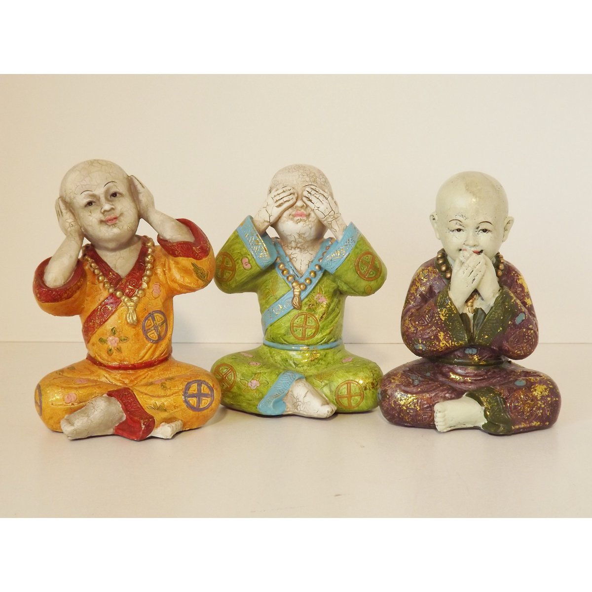 Colorful hear-see-shut up child monks