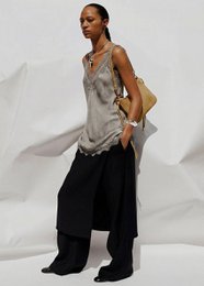 "Lace V-neck sleeveless tank top, neutral colors, delicate lace fabric, versatile casual wear"