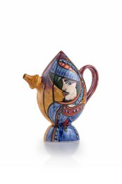Colorful ceramic teapot with intricate floral and geometric patterns, featuring a unique and whimsical design.