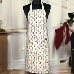 White apron with colorful Christmas tree pattern, perfect for holiday cooking and baking.