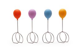  Colorful balloon-shaped napkin rings in a set of 4, made of durable plastic material, suitable for formal or casual dining occasions.