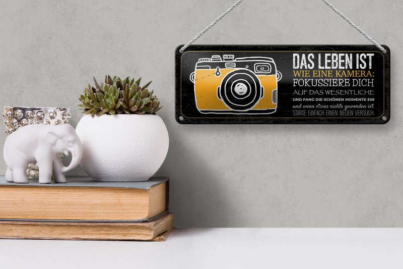 Tin sign saying 27x10 cm Life is like a camera Focus on the essentials