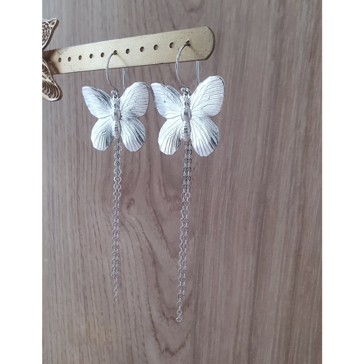 Long-length rhodium plated butterfly earrings