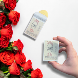 Solid hand cream in a 30 gram container, with a rose-themed design. The cream is made with natural ingredients and is suitable for all skin types.