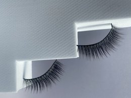 Long, thick, black false eyelashes made from vegan materials.