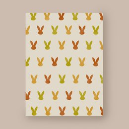 Colorful Easter card with repeating bunny pattern in shades of yellow and orange.