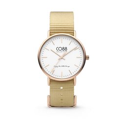 A stainless steel watch with a sand brown NATO strap. The watch face is white with a simple, minimalist design.