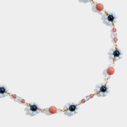 Floral beaded necklace with gold-plated crystals, featuring a mix of coral, navy, and clear beads arranged in a delicate, feminine design.