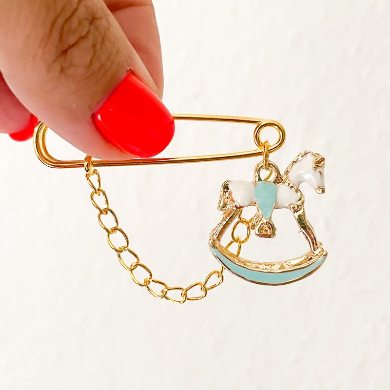 Pin lucky charm for baby boys as a gift for birth, rocking horse light blue